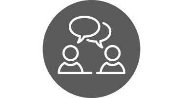 outline of two figures with speech bubbles over gray circle