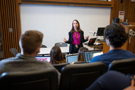 Carol Dahlke, School of Dentistry Dental Hygiene Class of 2007 and 2010, speaks with students after class.