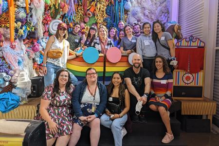 Advanced education learners and program coordinators pose at Can Can Wonderland