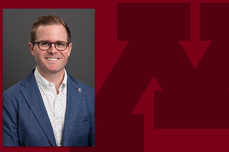 Headshot of Aaron Bumann on a branded background