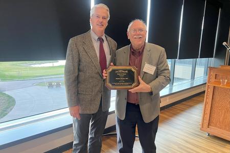 Stephen Shuman with plaque.