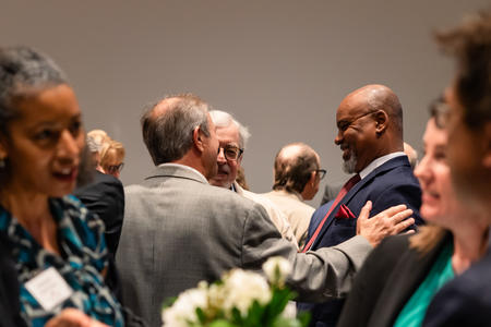 Attendees talk at the cocktail hour of the Summer Celebration of Donors