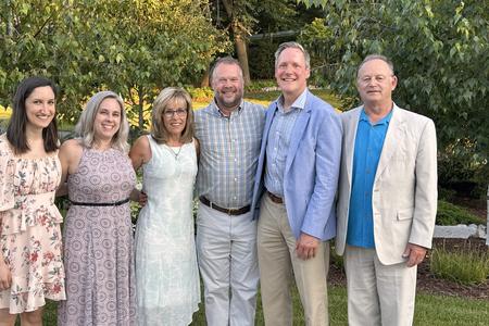 Derks and her husband with members of the Division of TMD & Orofacial Pain