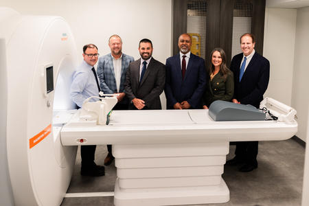 Members of the Orofacial MRI Center, Dentsply Sirona and Siemens pose with the dental-dedicated MRI