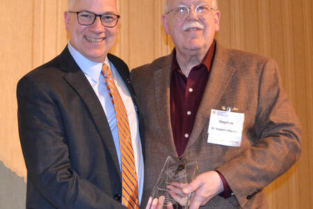 Shuman poses with his award and Carmelo Cinqueonce