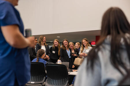 Students speak with upper class members at the involvement fair