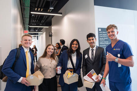 First-year DDS students pose with their second-year tour guide