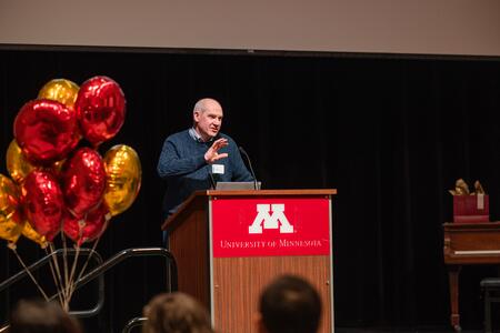 Costalonga addresses the audience at Research Day