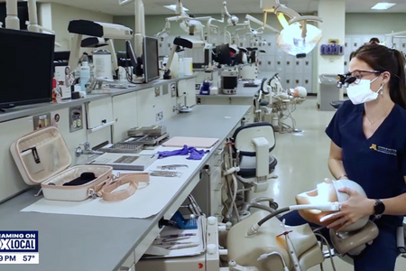Still from Fox 9 video depicts Beka Muhlenkamp working in the preclinic