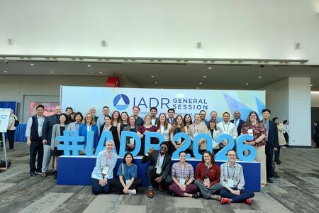 School of Dentistry attendees pose at the IADR sign