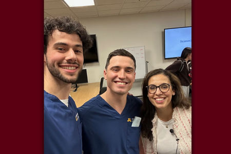 Two DDS students take a selfie with Eileen Crespo