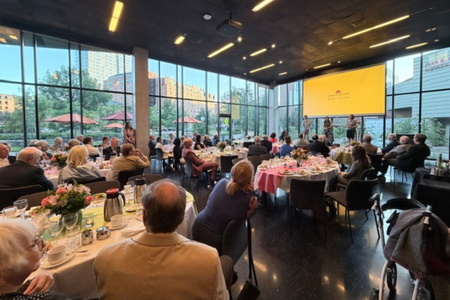 Huang, Uppgaard and Artingre stand onstage and answer questions from the Summer Celebration of Donors audience