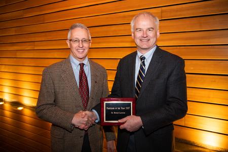 (From L to R) Dean Gary Anderson and Professor Brett Larson