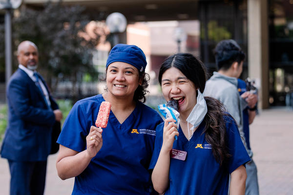 two DDS students eating ice cream at a social
