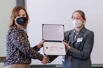 Sara Johnson and Christie Nixon pose with ESGR award
