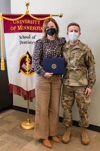 Johnson and Hildebrant pose with Johnson's award