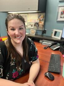 Danna Paulson at desk