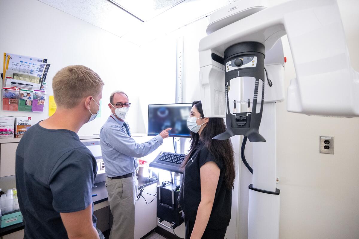 Dr. Noblett shows residents an x-ray