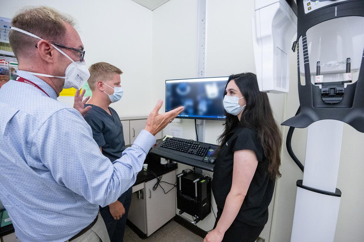 Dr. Noblett shows residents an x-ray