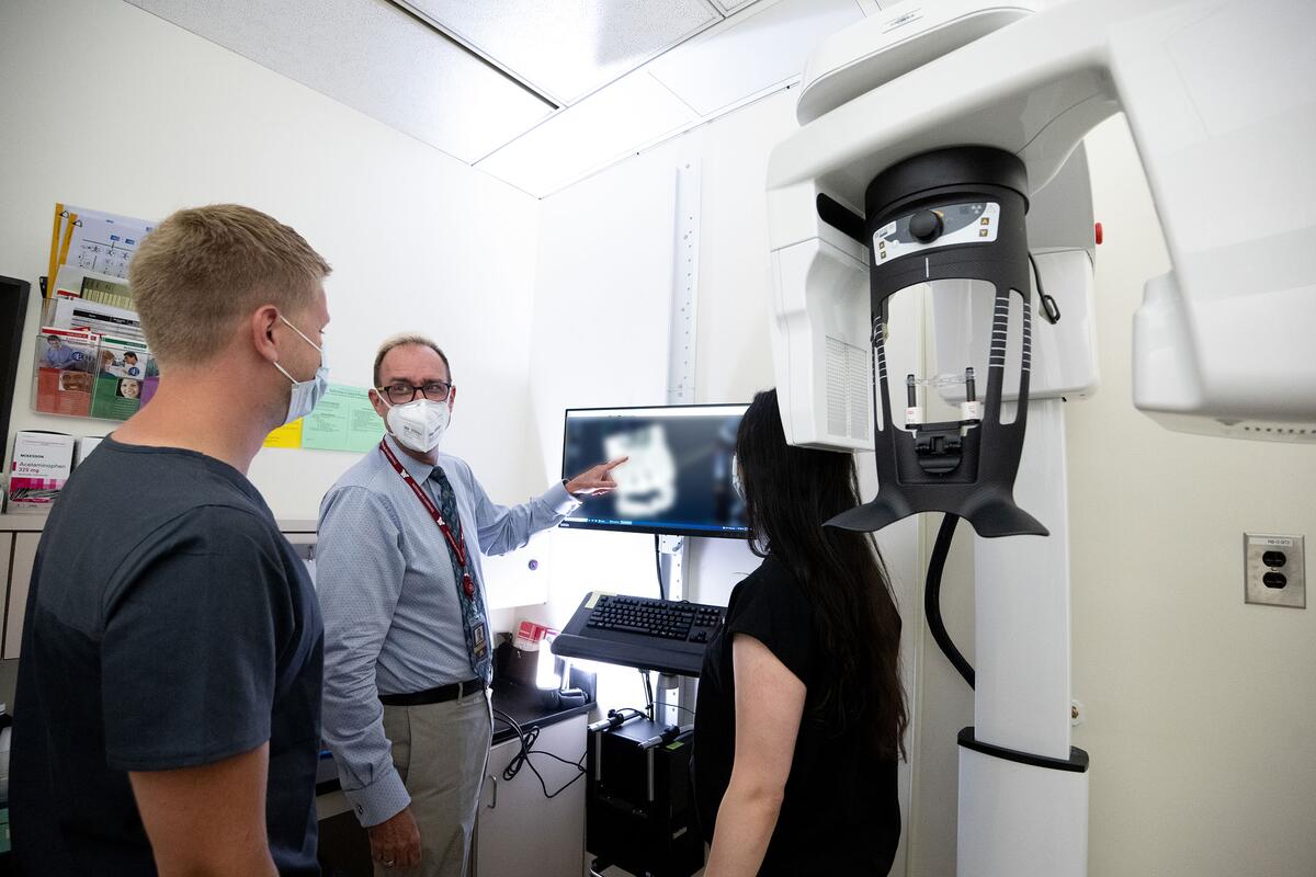 Dr. Noblett shows residents an x-ray