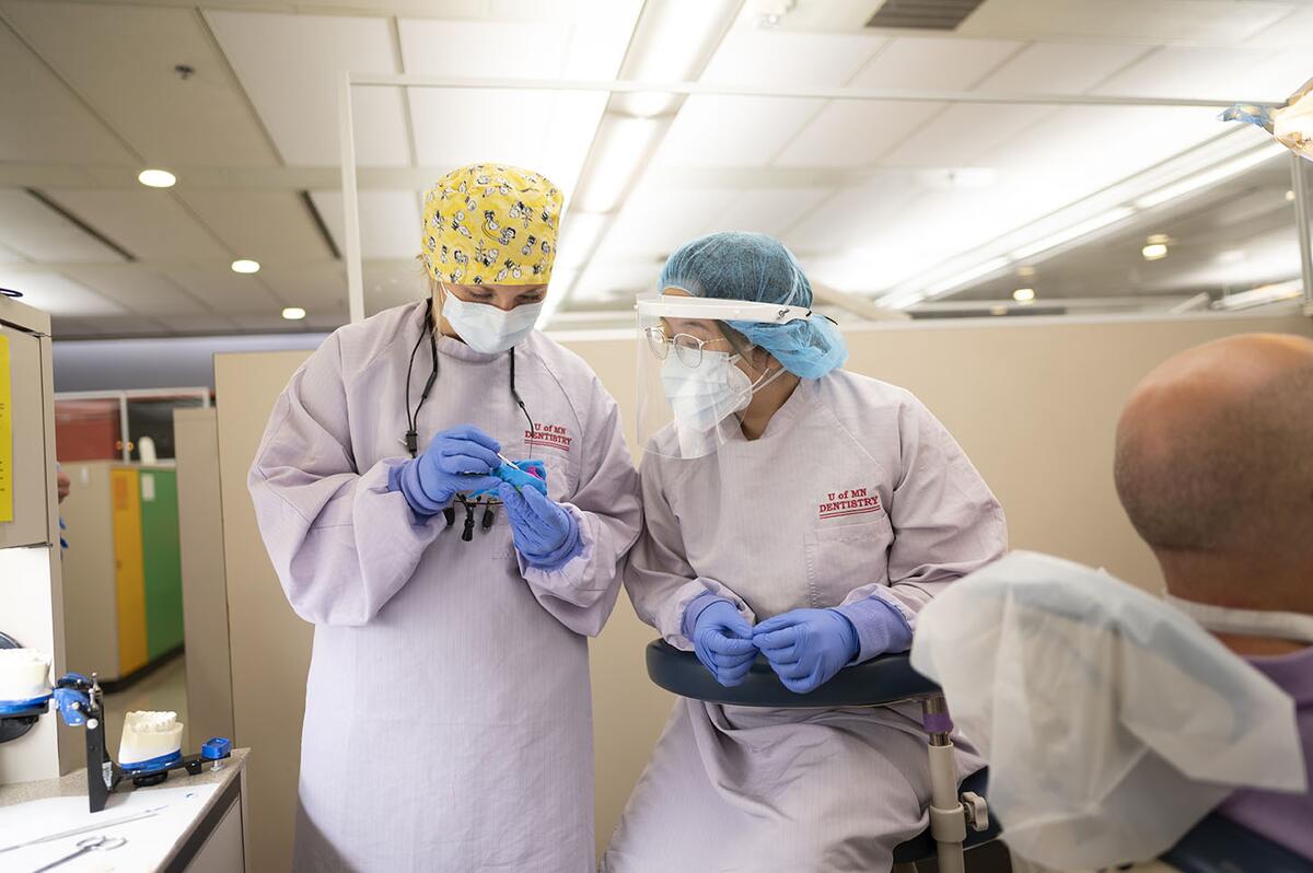 Prosthodontics faculty and residents discus care