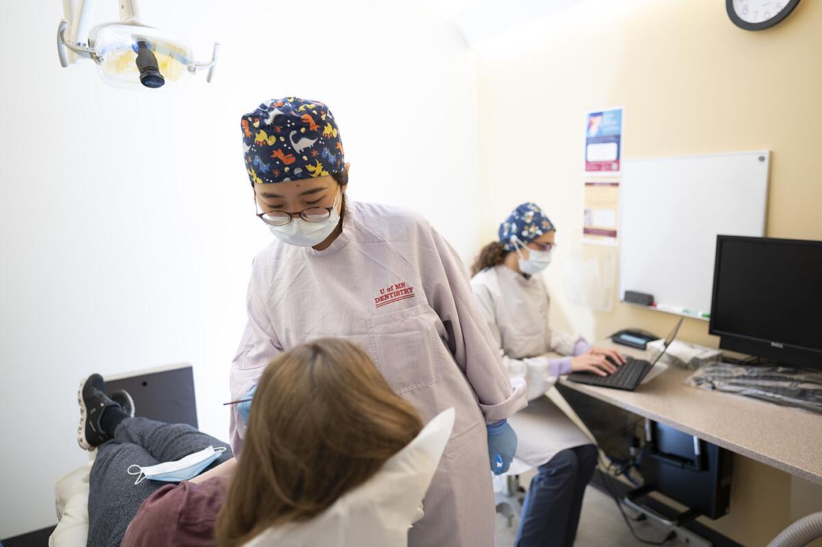 Residents treat a patient at the TMD, Orofacial Pain and Dental Sleep Medicine Clinic