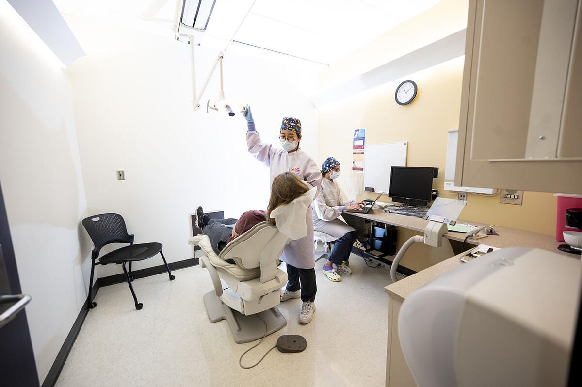Residents treat a patient at the TMD, Orofacial Pain and Dental Sleep Medicine Clinic
