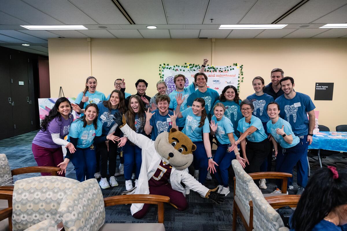 Give Kids a Smile committee poses with Goldy