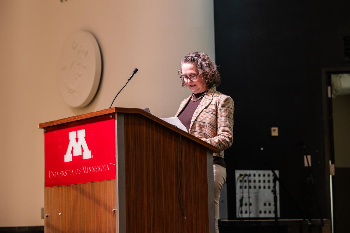 Artinger speaks at the podium