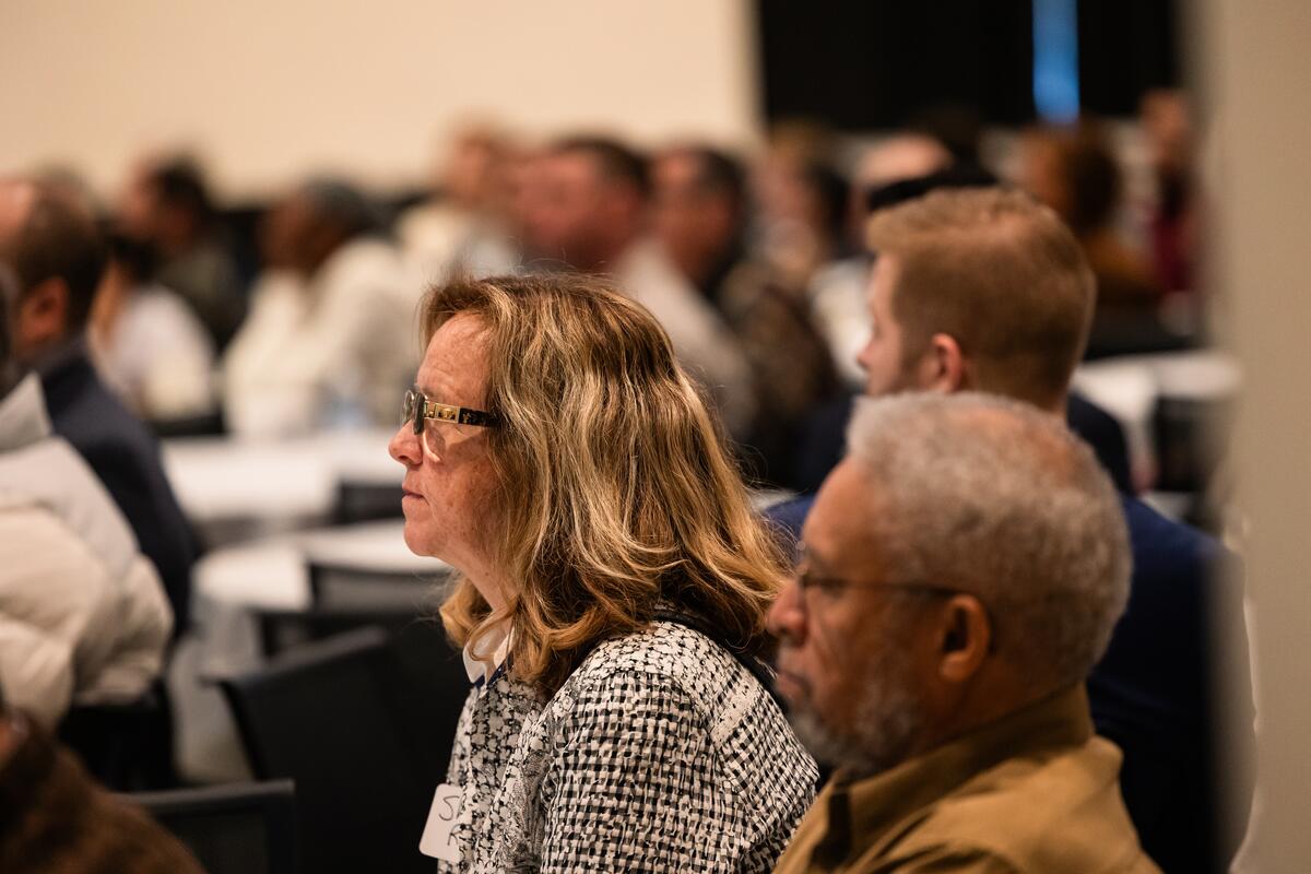 Sheila Riggs listens at research day