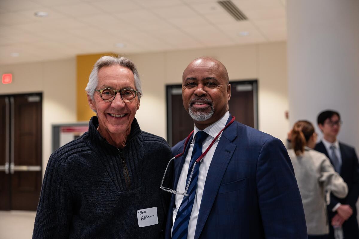 Mays and an attendee at Research Day