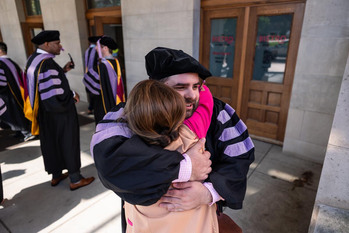 Graduate embraces a guest