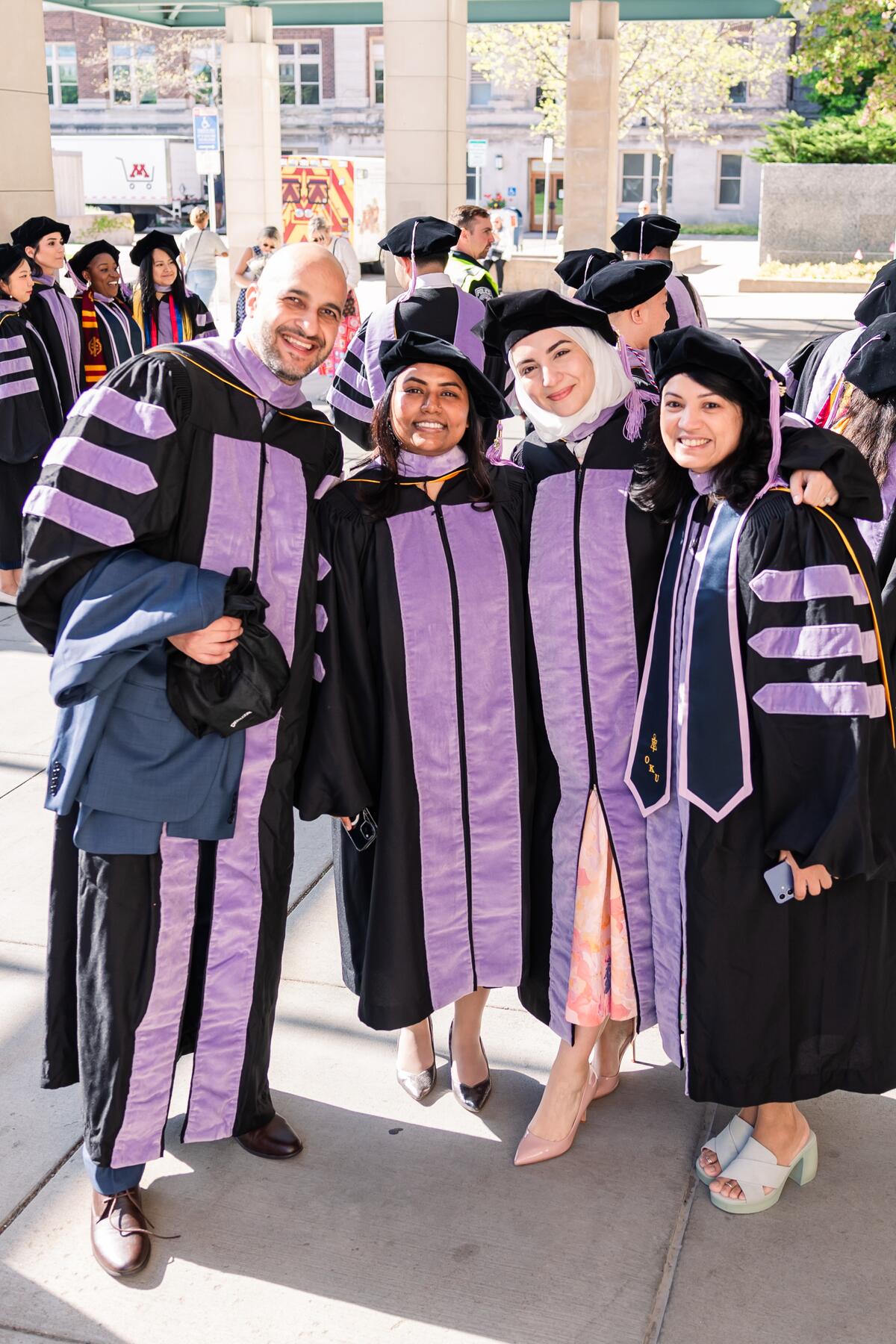 A group of graduates pose for a photo