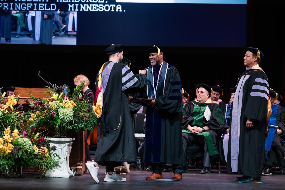 Dean Mays congratulates a Dental Hygiene graduate