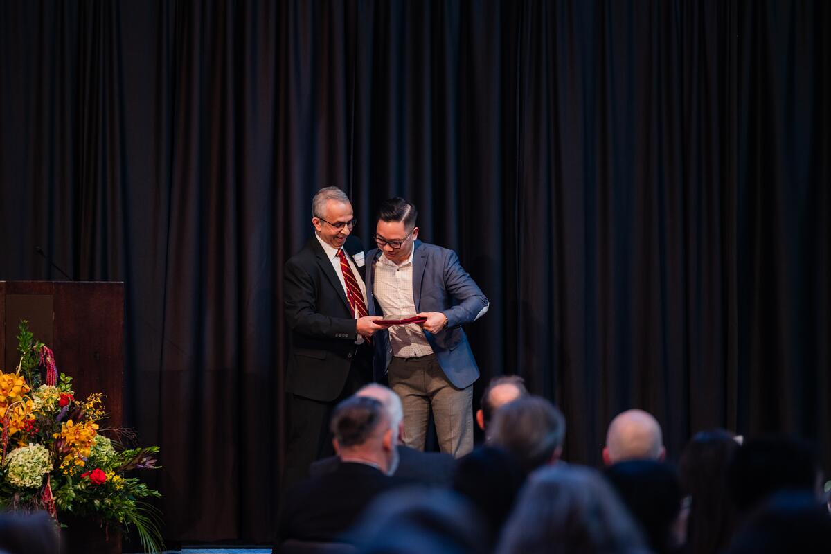 A student receives their award onstage