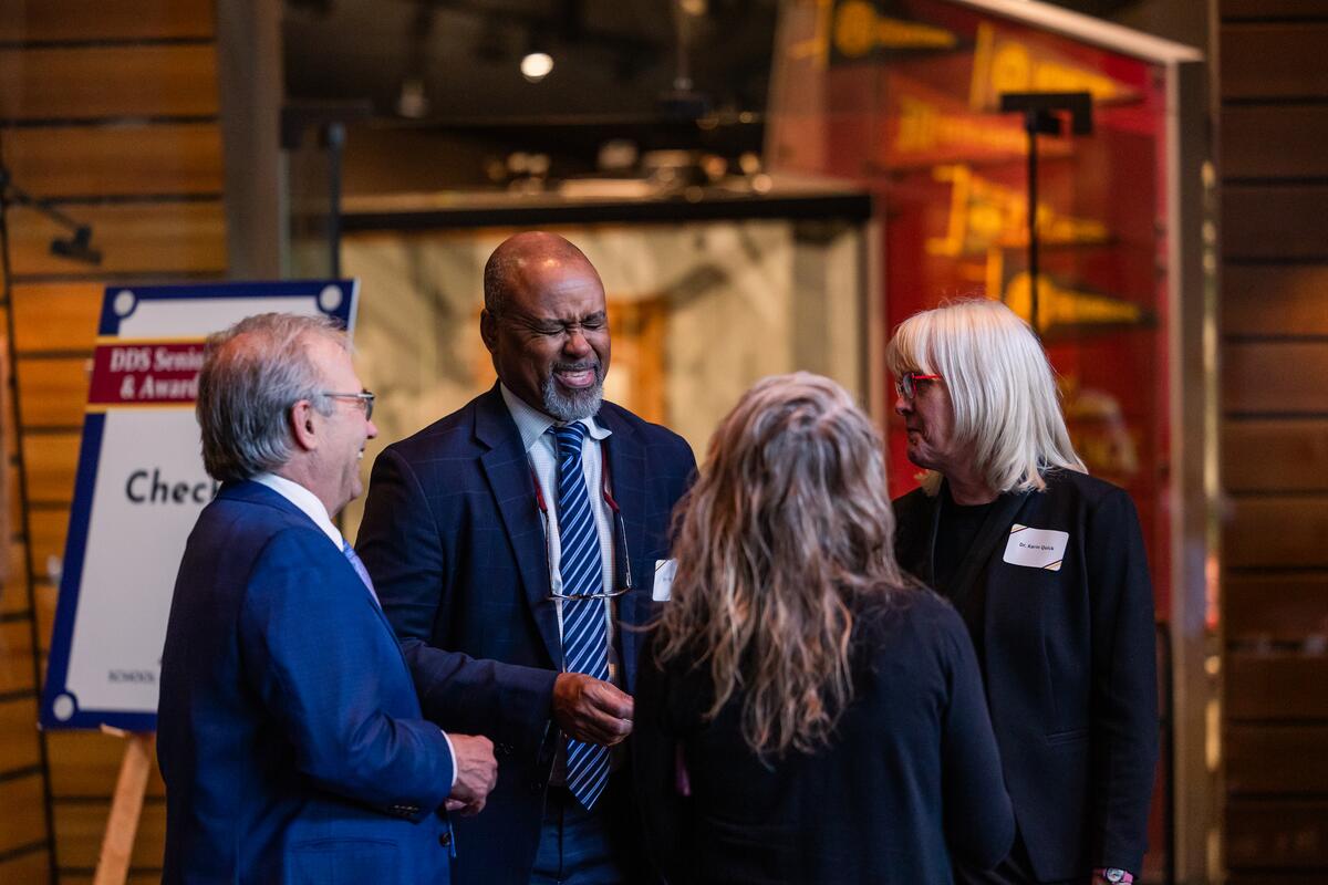 Dean Mays laughs with guests