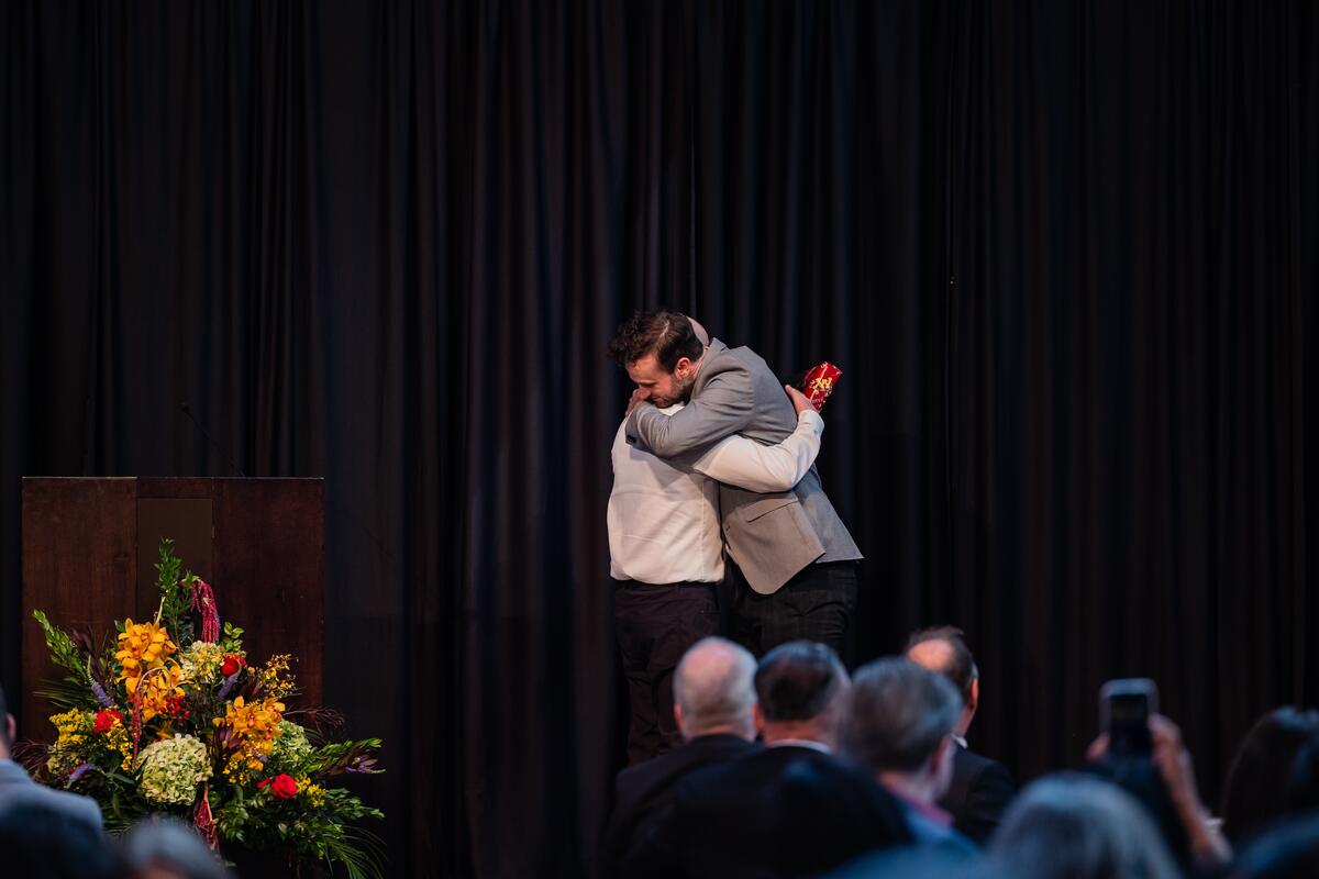A student receives their award onstage
