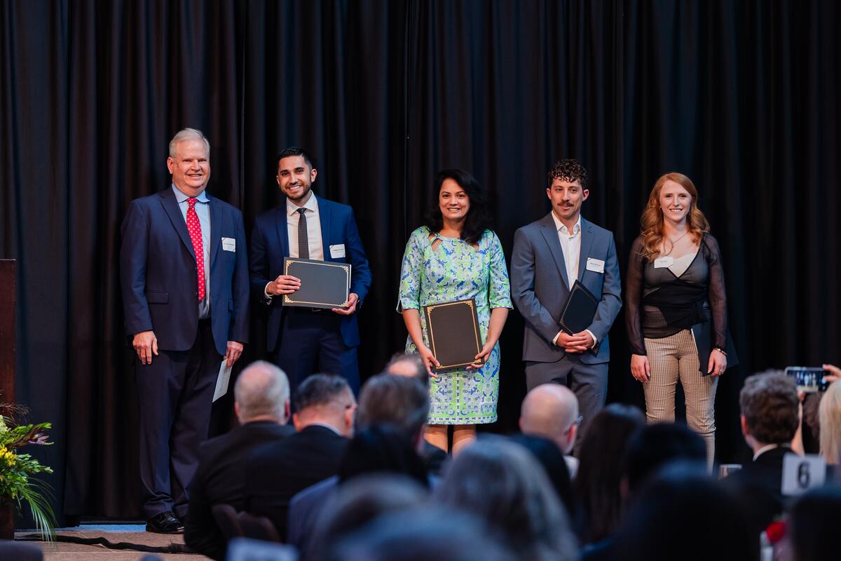 Students pose with their awards onstage