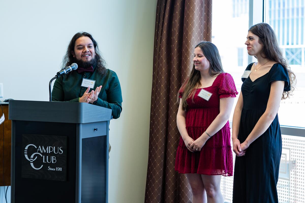 Pedro Lopez Vega speaks, while Kaitlyn Niemann and Danica Brannon stand next to him