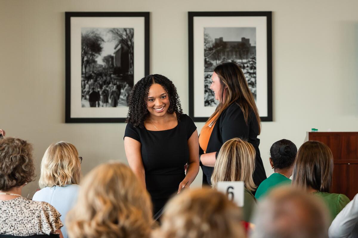 Mackenzie Judy smiles as she receives an award