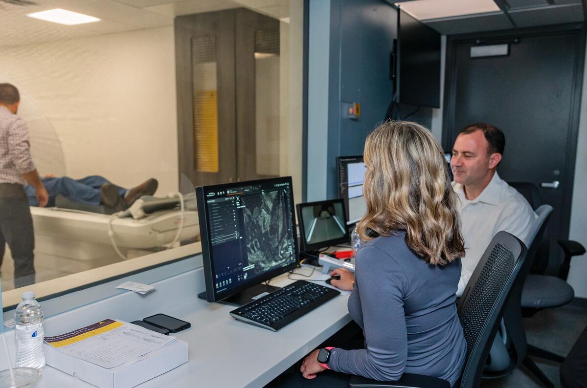 OMRIC staff review imagery from test patient.