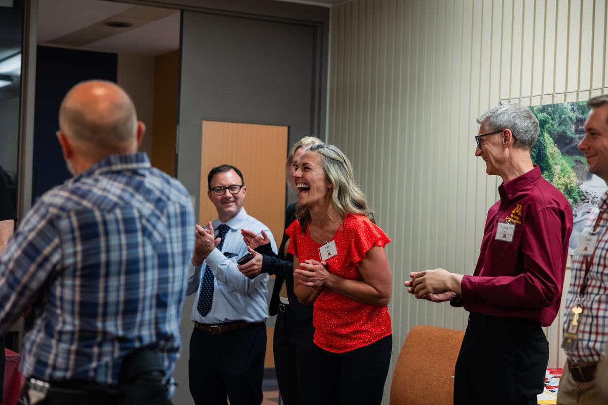 Katie Nieber laughs while Gaalaas speaks 