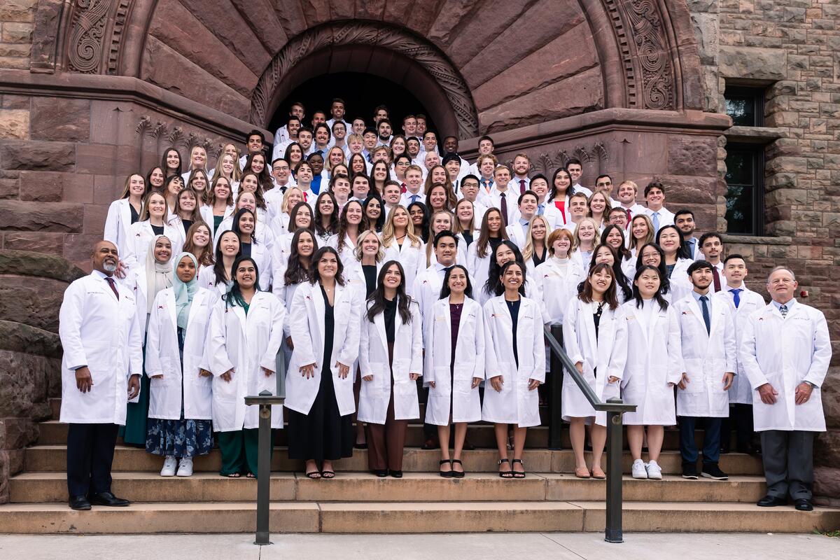 Group shot of DDS Class of 2028 at their White Coat Ceremony