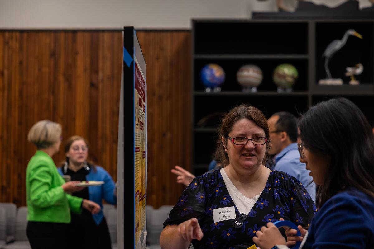 Woman presenting research at research retreat.