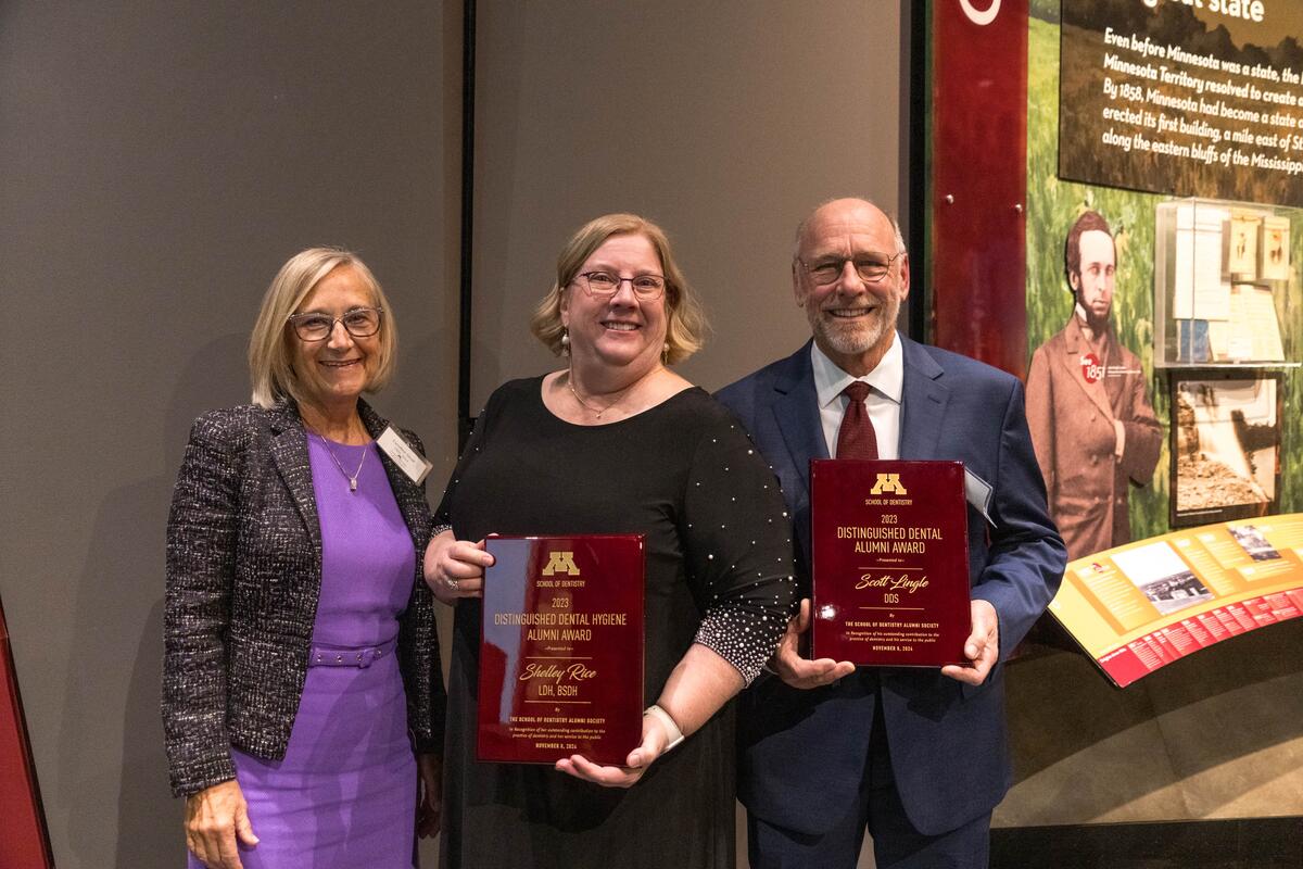 Guests at alumni weekend with awards