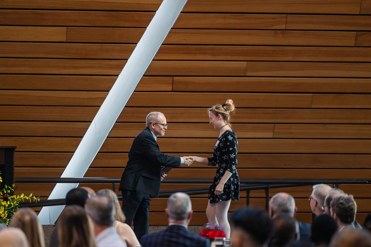 DDS student Molly Roettger receives an award onstage