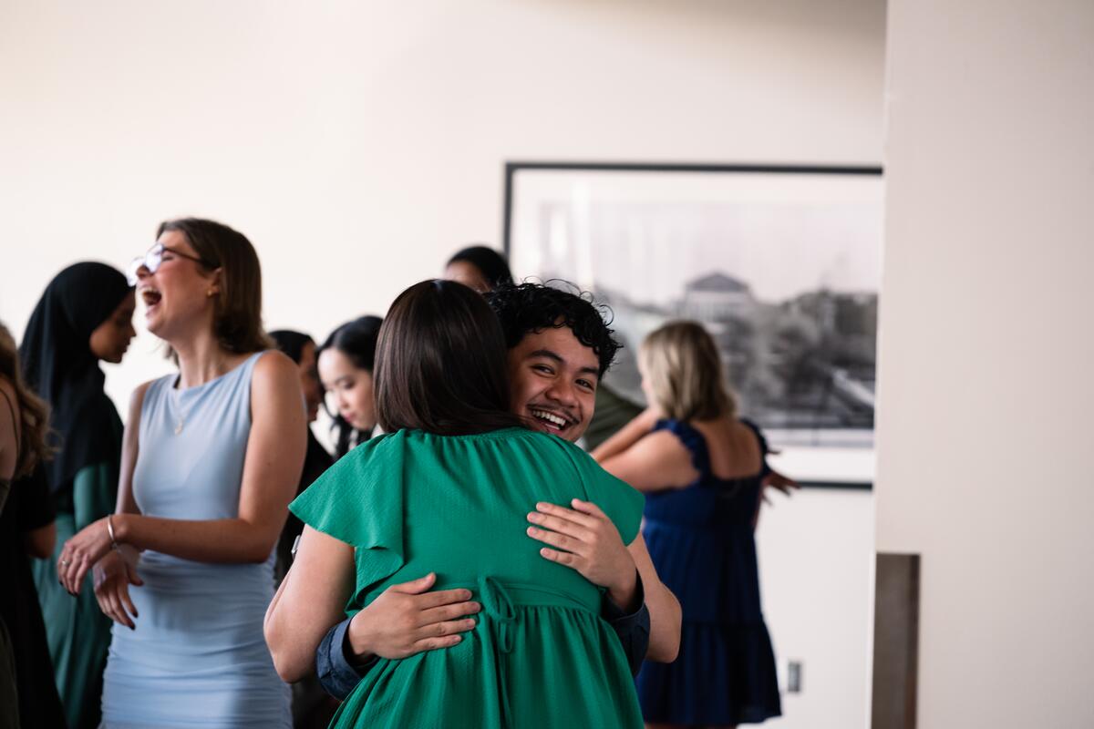 Student hugs a faculty member