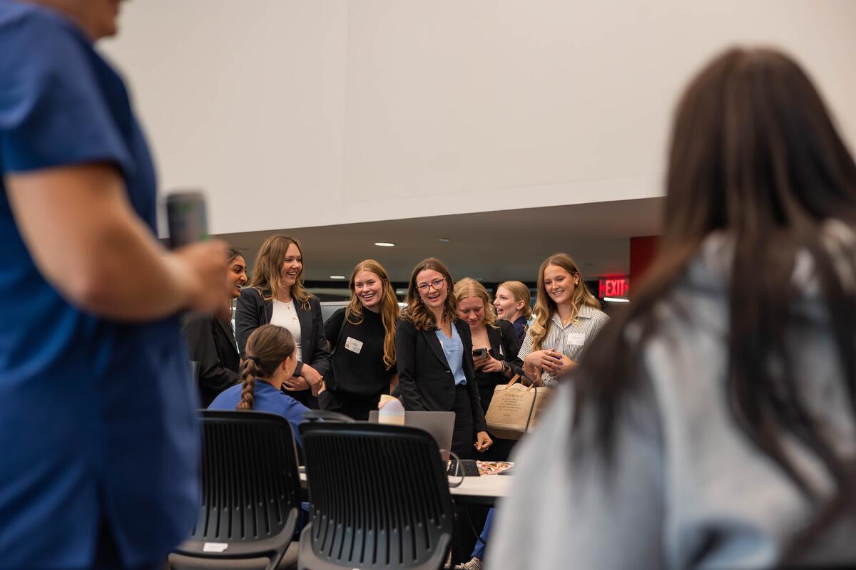 Students speak with upper class members at the involvement fair