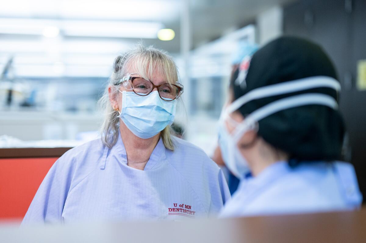 Aluma Judy Danielson connects with dental student in pre-doc clinic