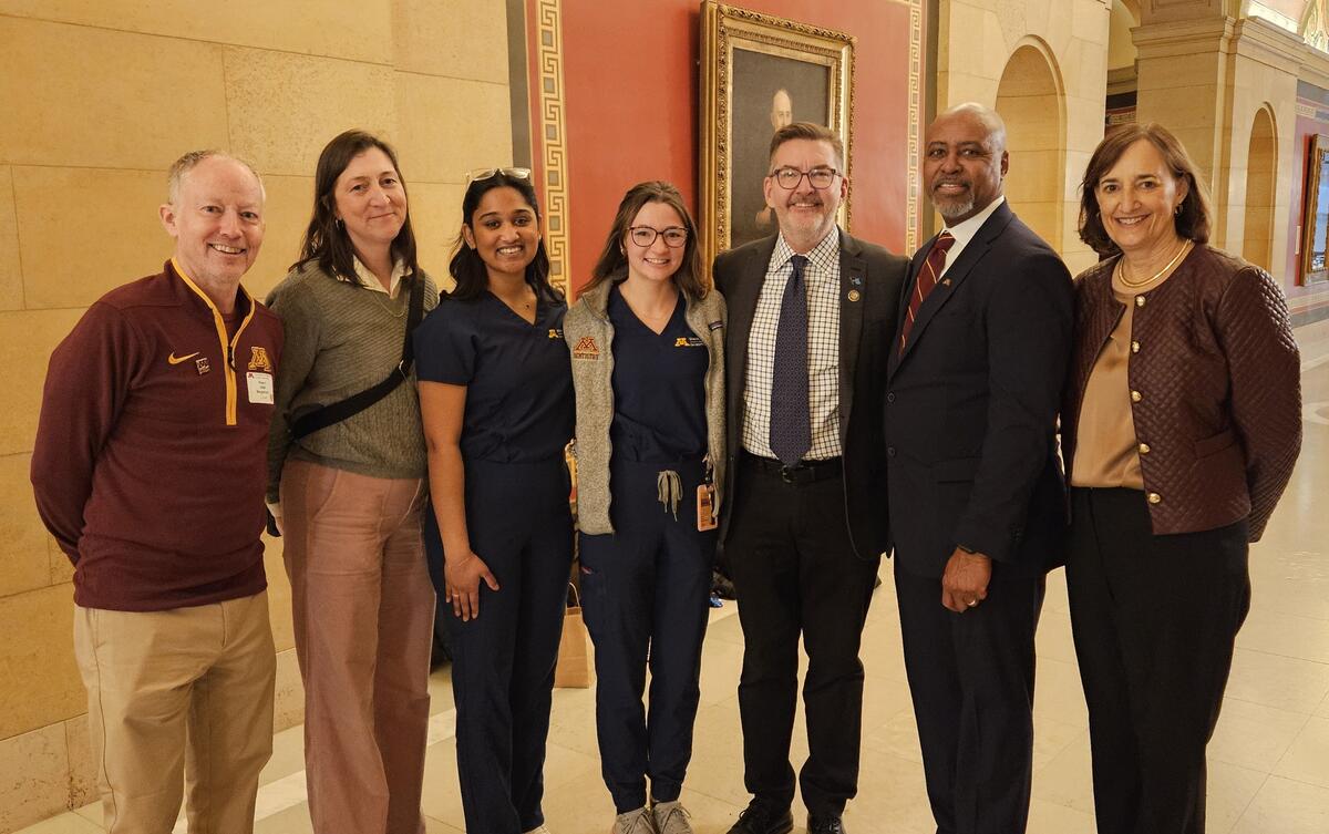 members of the school of dentistry pose at the state capitol